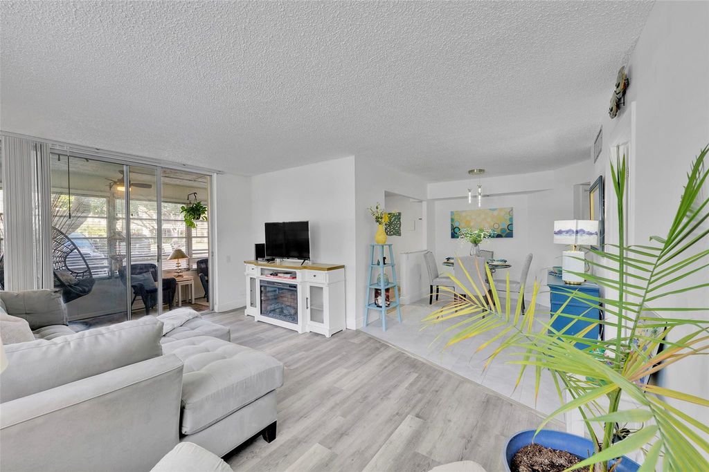 Photo of 9090 Lime Bay Boulevard #112, Tamarac, FL 33321 (MLS # B26045231)