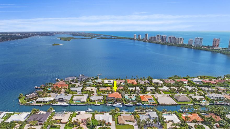 Beautiful Mediterranean style Waterfront home on Singer Island with 100 ft. dock.Direct ocean access, no fixed bridges. Open floor plan,12-24ft ceilings,crown molding throughout,stone fireplace,custom kitchen cabinetry w/11ft.island,commercial grade appliances,formal living and dining room,elevator,big screen movie theater w/wet bar and recliner style stadium seating. Huge master suite w/over-sized spa bathroom & walk-in closet. 3 car tiled garage. All impact windows and doors. Custom summer kitchen and pool w/southern exposure & sunset waterfront views, 100 ft. deep water dock, 60ft+ boatslip with 12,000lb lift,custom landscaping and lighting.Automatic back-up generator(36kw), interior fire sprinkler system. Minutes to Palm Beach Inlet, NO FIXED BRIDGES. Call for a private showing today!