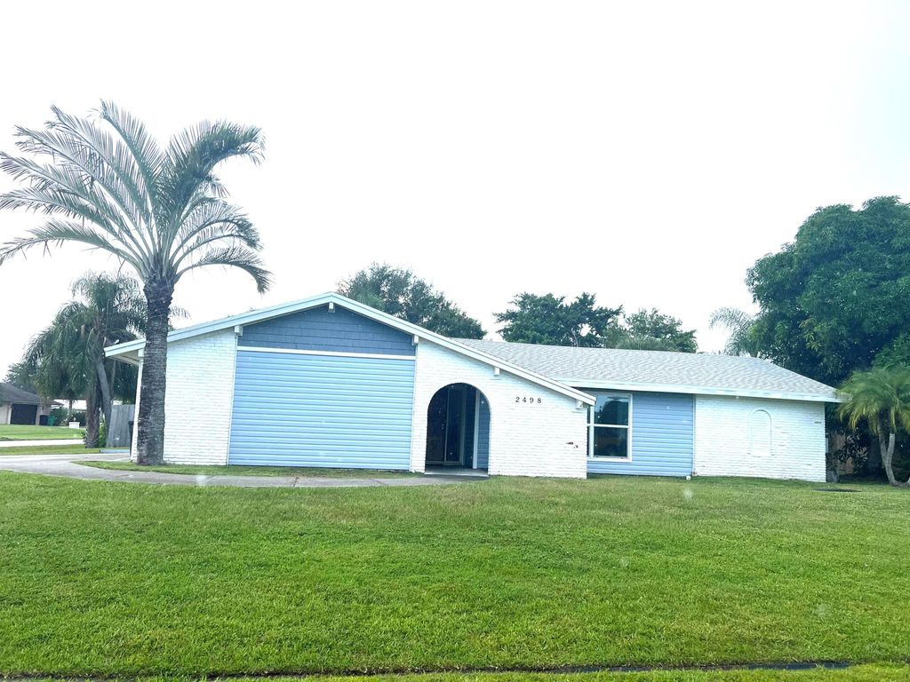 Photo of 2498 SE Pinero Road, Port St Lucie, FL 34952 (MLS # R10920422)