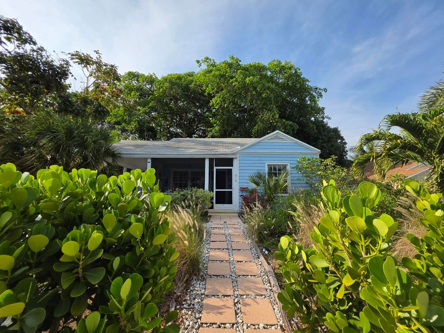 Looking for a cozy cottage?  Look NO FURTHER! This is a fantastic opportunity to buy in a quaint, quiet neighborhood with no HOA restrictions. This Key West cottage cute home offers excellent potential for additions of a pool/patio, making it an ideal open canvass for owner-occupants. The property is fully fenced around the back, perfect for relaxing under a century Banyan tree yielding peace/tranquility and awseome for pets! Plenty of room for a pool, patio and fabulous for entertainment area! From the mninute you walk into this charmer, you feel the warmth of the original hard wood floors, it's arched entry ways, and galley kitchen. The roof is 2007, water heater 2012, the HVAC system 2020, also made room to host the laundry room inside!. Located just 3 miles from the beach, this home is conveniently positioned near major highways, City Place, bridge to the island for fantastic eateries, antique row, shopping our local renowned Kraviz Center, downtown West Palm Beach - nights on Clematis, PBI Airport, PB Zoo, science center, and many more local attractions. This is a must see, where the only limiatations are your imaginantion!