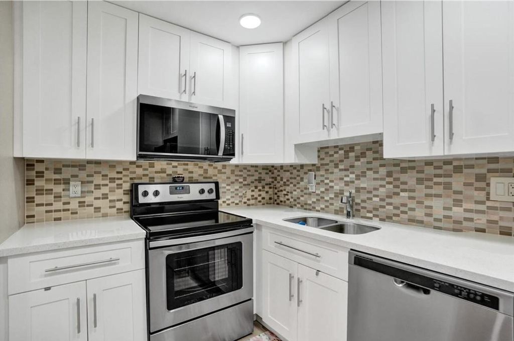 Photo of 4980 E Sabal Palm Boulevard E #124, Tamarac, FL 33319 (MLS # B26019092)