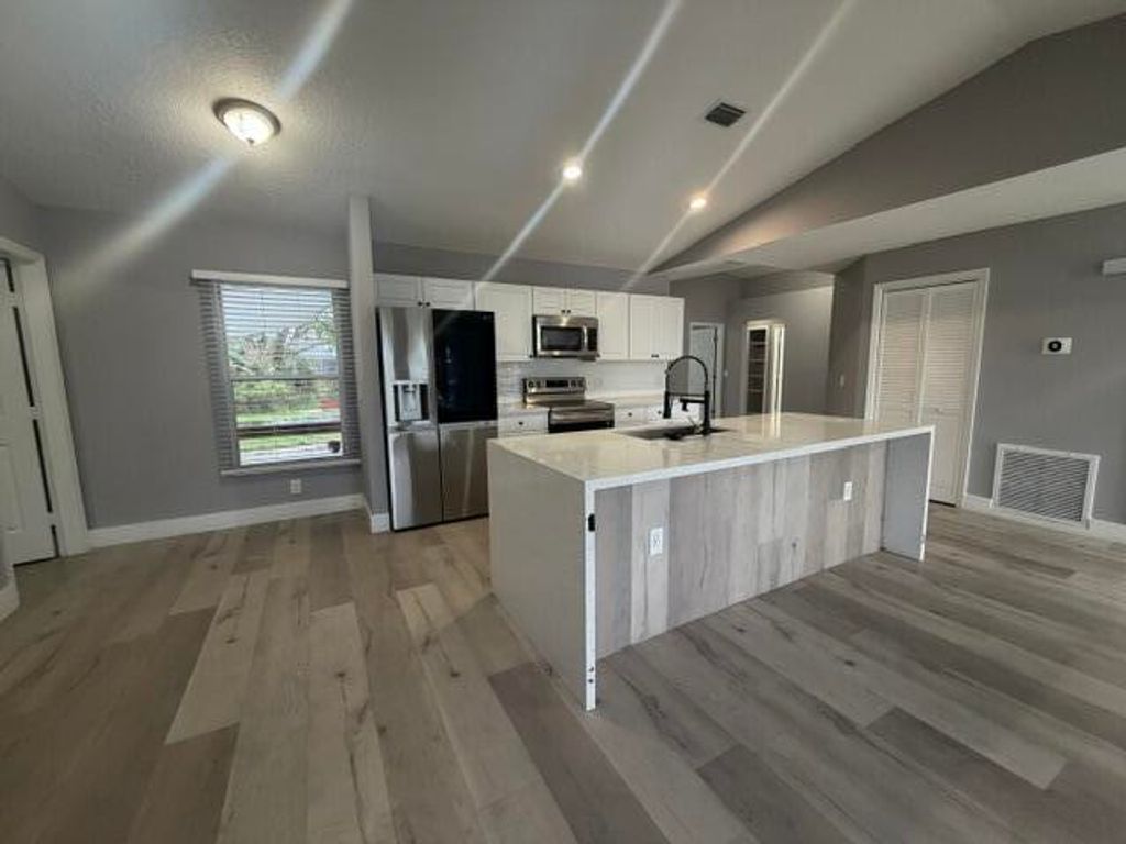 Photo of 1717 SW Burlington Street, Port Saint Lucie, FL 34984 (MLS # B26024474)