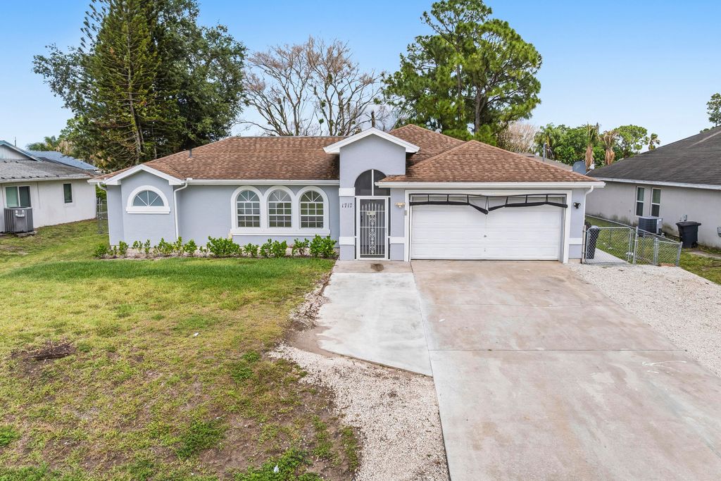 Photo of 1717 SW Burlington Street, Port Saint Lucie, FL 34984 (MLS # B26024474)