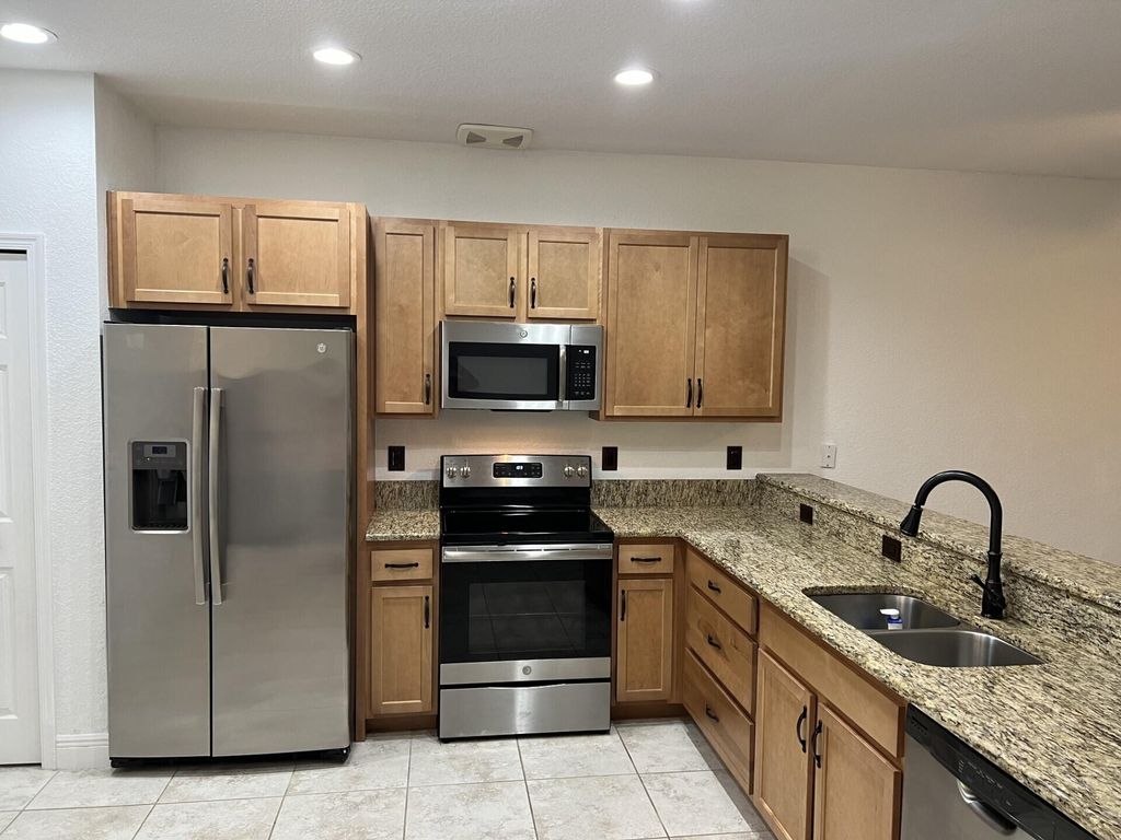 Photo of 1007 NE Trailside Run, Port Saint Lucie, FL 34983 (MLS # R10926911)