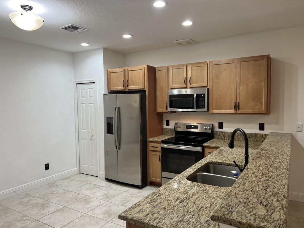 Photo of 1007 NE Trailside Run, Port Saint Lucie, FL 34983 (MLS # R10926911)