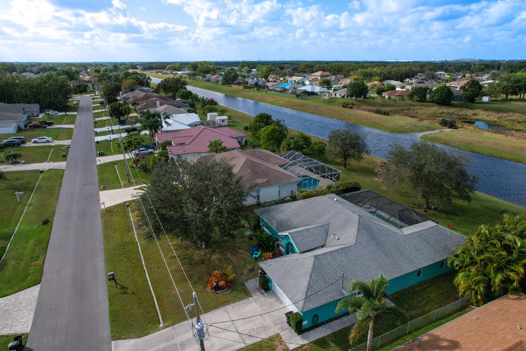 Photo of 5442 NW Edgewater Avenue, Port Saint Lucie, FL 34983 (MLS # R10779019)