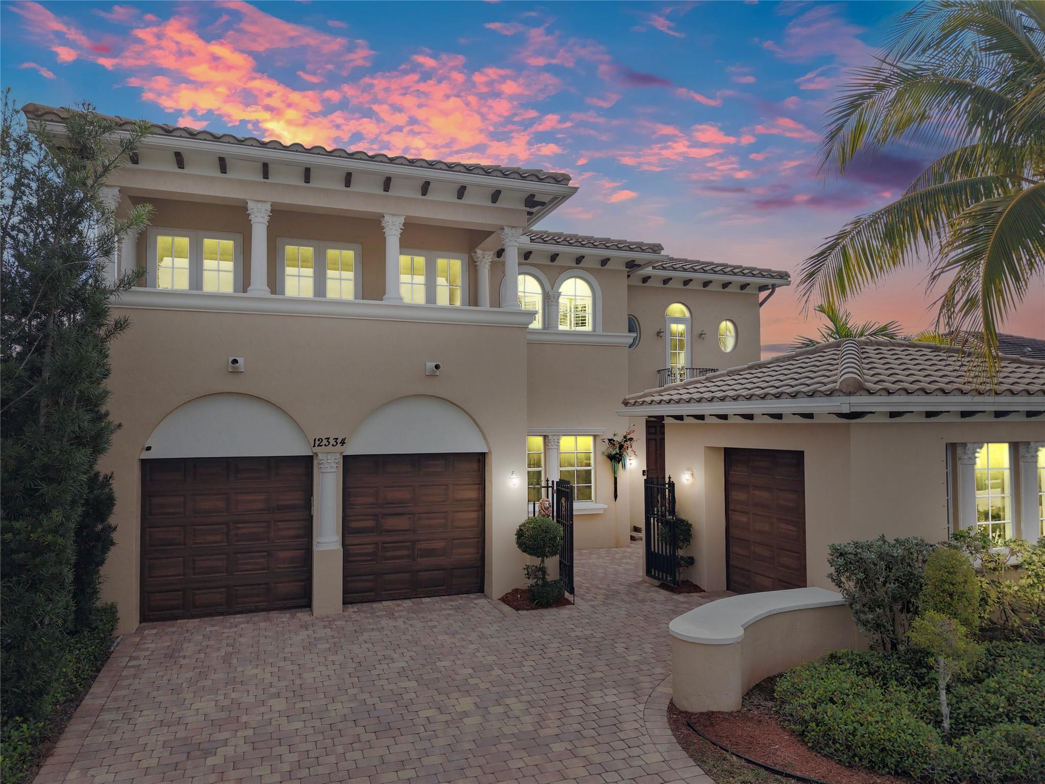 Stunning 5-bed, 3-bath two-story home located in the highly sought after community of Heron Bay offers luxury and comfort throughout. Featuring elegant marble floors and a marble circular staircase, the spacious layout includes an oversized kitchen that flows into the family room with beautiful pool and lake views. The versatile bonus room can serve as a fifth bedroom or playroom. Enjoy a large primary suite with sitting area and an over-sized en-suite. Three private balconies. A backyard retreat with tranquil lake views. Community amenities include resort-style pools, clubhouse, gym, and 24-hour security. Zoned for A-rated schools.