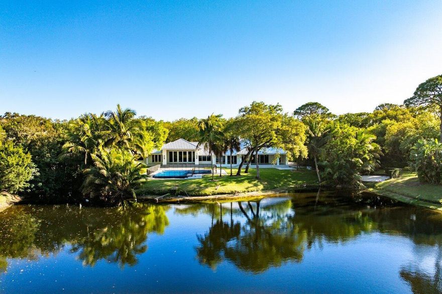 Walk into this residence and be stunned by the beauty of the lake views! Experience unparalleled luxury in this fully reimagined estate, situated on the premier, most coveted lakefront lot in Foxe Chase! The only property in the community offering a full length, unobstructed long lake view. This totally rebuilt and expanded home is a true masterpiece! Nestled within the prestigious Foxe Chase enclave of Delray Beach-an exclusive community of just 43 homes, each on a sprawling one-acre lot. This residence offers both privacy and breathtaking surroundings.Meticulously redesigned, this home was taken down to the concrete shell and completely rebuilt and expanded by 1000 square feet, including all new electrical, all new plumbing, new metal roof, all new impact windows and doors,