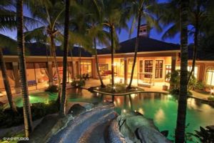 Located in the heart of coveted Jupiter.  This magnificent estate sits on almost an acre of sparkling waterfront property.  The estate features a stunning 6 bedroom/6 bath Mediterranean style home with multiple outdoor living spaces, a private executive retreat and a separate 2 bedroom/2 bath Guest House.   Just completed new Master suite and bath with slab Quartz flooring, dual spa showers with light and audio system, steam room, and yoga studio.  A true tropical oasis with a resort style pool/spa and laz