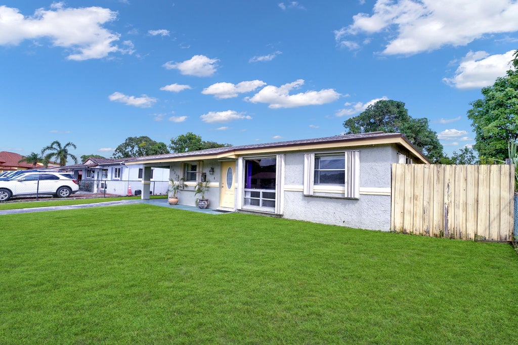 Photo of 1420 NW 33RD Terrace, Lauderhill, FL 33311 (MLS # B26084893)