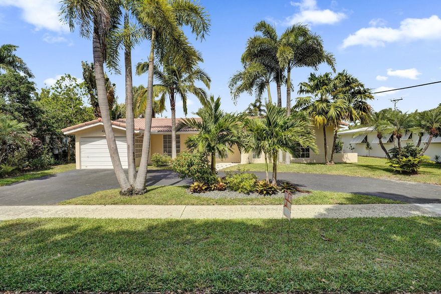 Perfectly located in East Boca's highly sought-after Royal Oak Hills neighborhood, this home offers an oversized private yard with lush landscaping, a large pool, and no HOA fees. Just minutes to Mizner Park, beaches, dining, shopping, and A-rated schools, including Addison Mizner K-8 and Boca Raton Community High School. Interior highlights include brand-new flooring, fresh interior paint, remodeled bathrooms, a desirable split floor plan, abundant natural light, large windows, stainless steel appliances, hurricane protection, a circular driveway, and an expansive covered patio ideal for entertaining.