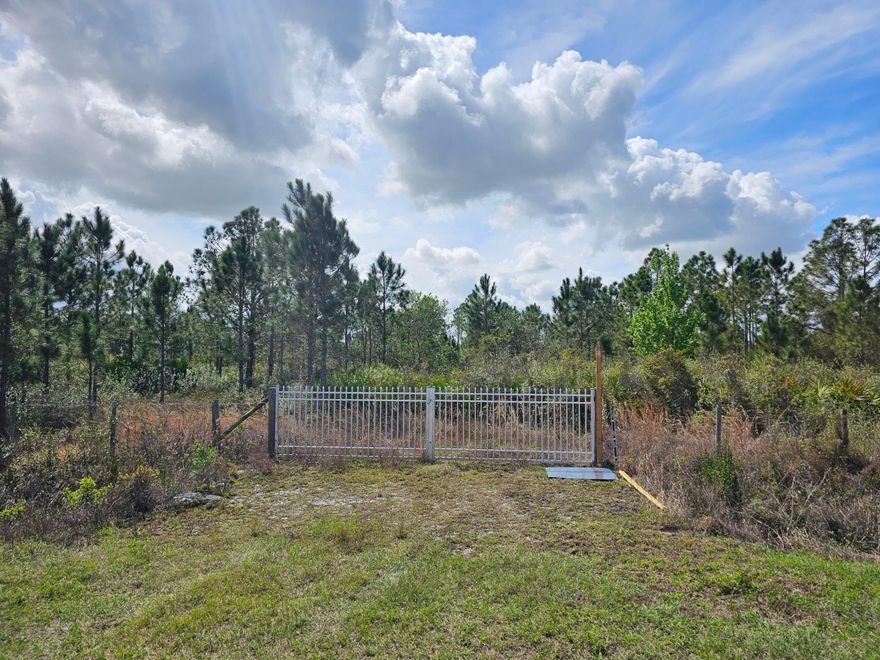 Improved 1.25 acre lot. Completely fenced with gated front entry. Culvert, well and water tank located on the property. Electric available. Zoned for a double wide manufactured home, modular home, or site-built single family. 5 miles from The Kissimmee River Preserve State Park.
