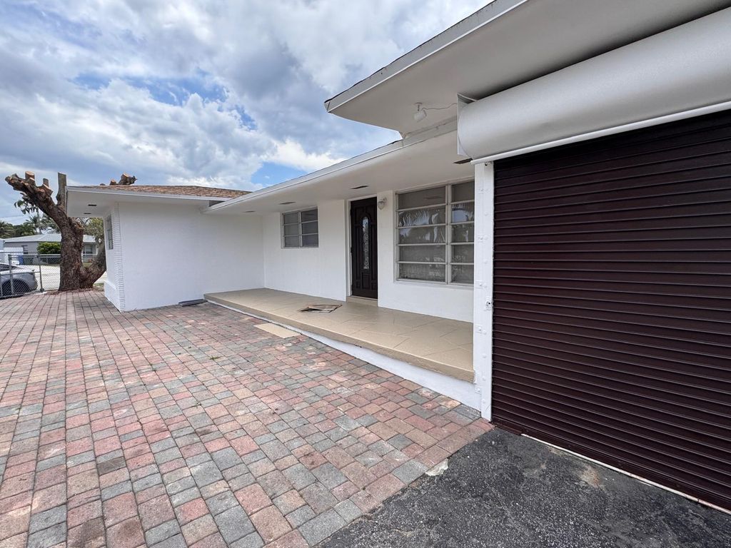 Photo of 11 NW 56th Street, Oakland Park, FL 33309 (MLS # B26021717)