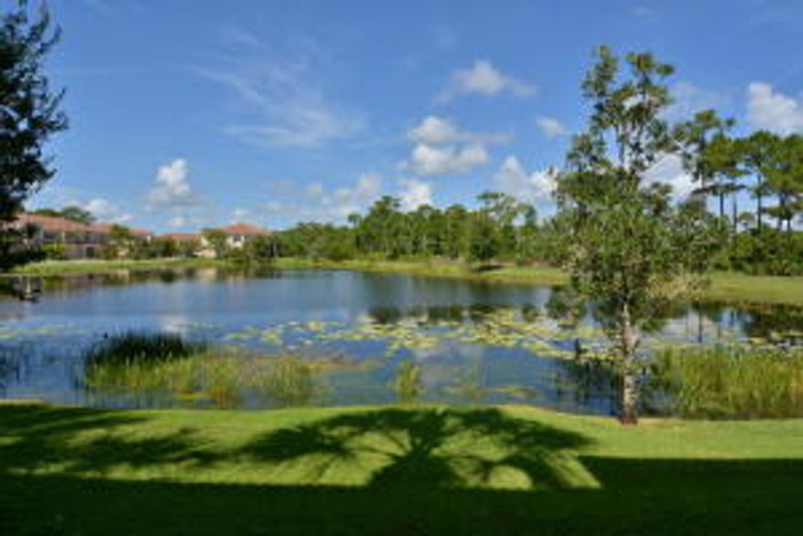 SIT ON YOUR PATIO OVERLOOKING THE TRANQUIL LAKE AND PRESERVE AND ENJOY!!  Like new, immaculately maintained 2 story townhome in a gated community.  Downstairs living area, kitchen and separate laundry room are tiled, bedrooms carpet, all newer appliances, front load washer & dryer. Screened patio outside the living area overlooks the lake &and preserve. Upstairs are 3 bedrooms & a large loft ideal for a den or playroom. The wall mounted TV in the loft is included. Home has been freshly painted inside & outside, plantation shutters on all interior windows, including the garage, accordion shutters & hurricane panels on exterior windows, screened patio with privacy fence, sealed garage floor. See attachment for complete list of upgrades. Termite & WDO inspection completed & results are clean.