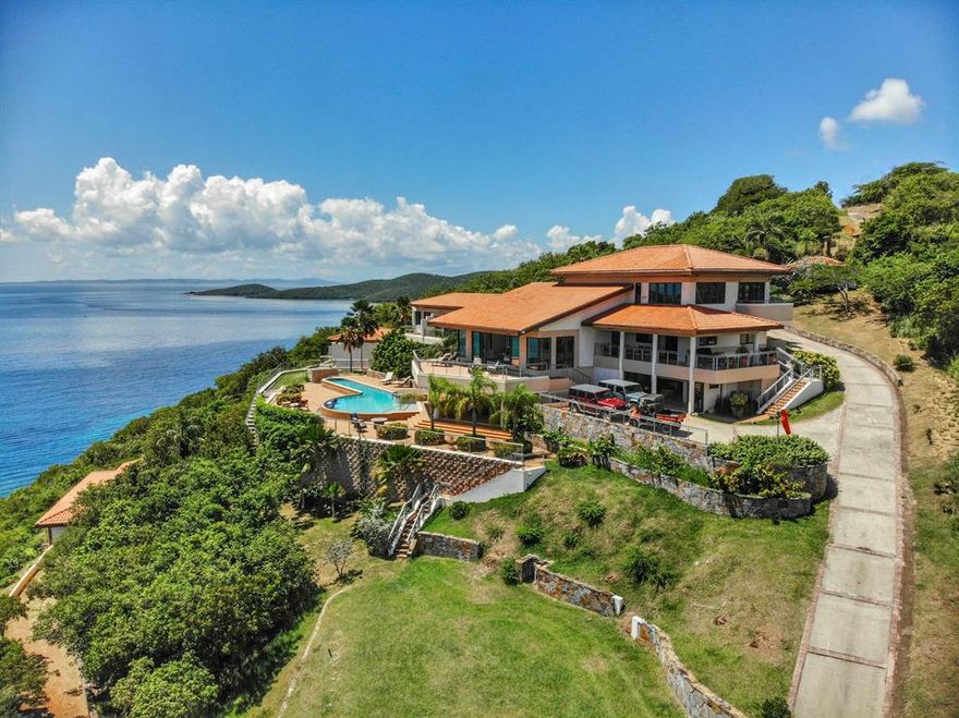 Located just off the coast of Puerto Rico on the Island of Culebra in the Spanish Virgin Islands, this 6-bedroom, 7.5-bathroom Italian villa-style home is a hillside masterpiece in a private setting with spectacular ocean views. Resting on five beautiful acres that roll down to the Caribbean Sea, this 12,000 sq. ft. house is equipped with a home gym, indoor basketball court, and a gourmet kitchen with a sub-zero refrigerator, wine cooler, Viking stove and three sinks. Five of the bedrooms have en suite bathrooms, and there is a separate casita for spillover friends and family as well as a caretaker's cottage. Adjoining the house is a full outdoor summer kitchen equipped with a Sedona Grill, dishwasher, second wine cooler, storage room and full bathroom, as well as a tropical pool and patio overlooking a tranquil Caribbean blue bay perfect for kayaking, paddle boarding and snorkeling. Puerto Rico is only a short ferry ride or puddle jump away, offering additional exploration opportunities, excursions, and cuisines.

Whole compound generator and water cistern system.

This property offers the potential to be a boutique hotel, spa retreat etc. There is an incredible piece of the land that is down on the water. Mooring possibilities and even seaplane landing for guests. This home is truly something special!