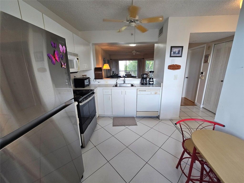 Photo of 9525 Weldon Circle #410, Tamarac, FL 33321 (MLS # F10539655)