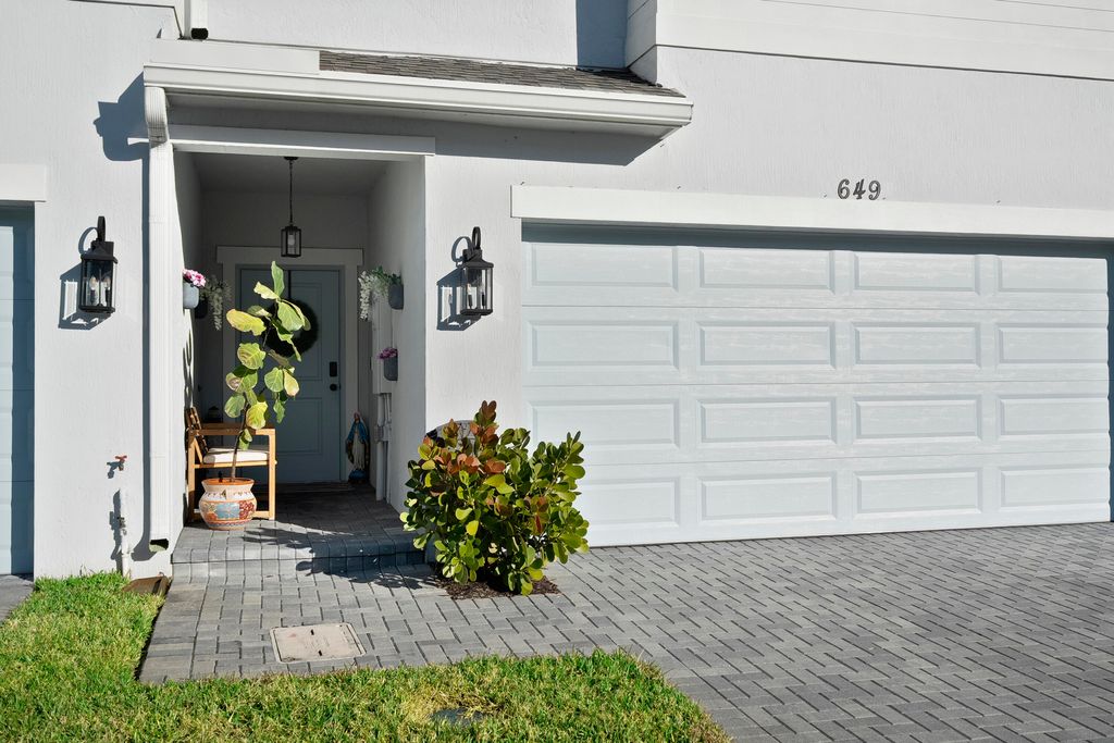 Photo of 649 NE Waters Edge Lane, Port Saint Lucie, FL 34983 (MLS # B26008463)