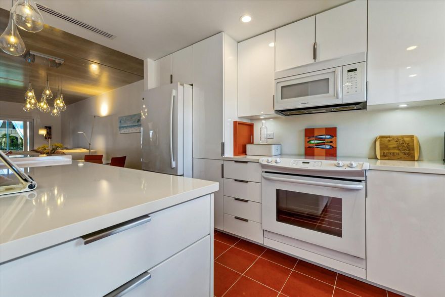 Welcome to paradise on Singer Island, where coastal luxury meets relaxed beach living. This fully renovated condominium offers a bright, modern interior with elegant finishes and breathtaking water views. Open-concept living space featuring updated flooring, a designer kitchen with sleek cabinetry, quartz countertops, newer appliances. The spacious living & dining areas flow seamlessly onto a private screened & covered porch water views sparkling Atlantic Ocean nearby waterways. Beautifully updated bedrooms provide a peaceful retreat renovated bathrooms with contemporary fixtures, inspired details. Hurricane Impact Windows.  Private washer & dryer, central vacuum, & Ample storage space. Boats slips may be available to purchase or rent. New Seawall & Roof no assessments. Live the Ultimate Singer Island Lifestyle   Life on Singer Island is all about enjoying the water and the outdoors. Spend your mornings kayaking, paddleboarding, or fishing along the beautiful Intracoastal waters, then head to the pristine shoreline of Singer Island Beach for swimming, sunbathing, or long walks along the sand. Boating enthusiasts will love the easy access to marinas and deep-sea fishing just minutes away. Golf lovers have several exceptional courses nearby, including PGA National Resort, known for championship golf and beautiful fairways. When it's time to explore, enjoy shopping and dining at nearby destinations like The Gardens Mall and waterfront restaurants along the marina at Sailfish Marina, where fresh seafood and sunset views are part of everyday life. Waterfront activities, golf, shopping, and great restaurants—Singer Island truly offers the best of the South Florida lifestyle.  Owners have paid for all assessments which include a new roof, and Seawall.  Life on Singer Island is all about enjoying the water and the incredible coastal lifestyle. Just minutes from the beautiful sands of Singer Island Beach, residents enjoy boating, kayaking, paddleboarding, and world-class fishing right off the coast. The nearby Gulf Stream waters make this area famous for deep-sea fishing, where anglers regularly catch sailfish, mahi-mahi, and tuna. Golf enthusiasts can play championship courses nearby at PGA National Resort, while shoppers and food lovers will enjoy the upscale stores at The Gardens Mall and waterfront dining at Sailfish Marina. Boating, beach days, world-class fishing, golf, shopping, and great restaurants—this is the lifestyle that makes Singer Island so special.