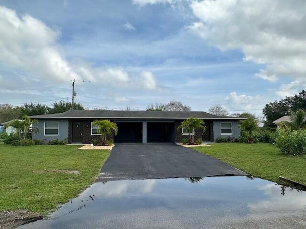 Photo of 3136 Evergreen Lane, Lake Worth, FL 33461 (MLS # R10966859)