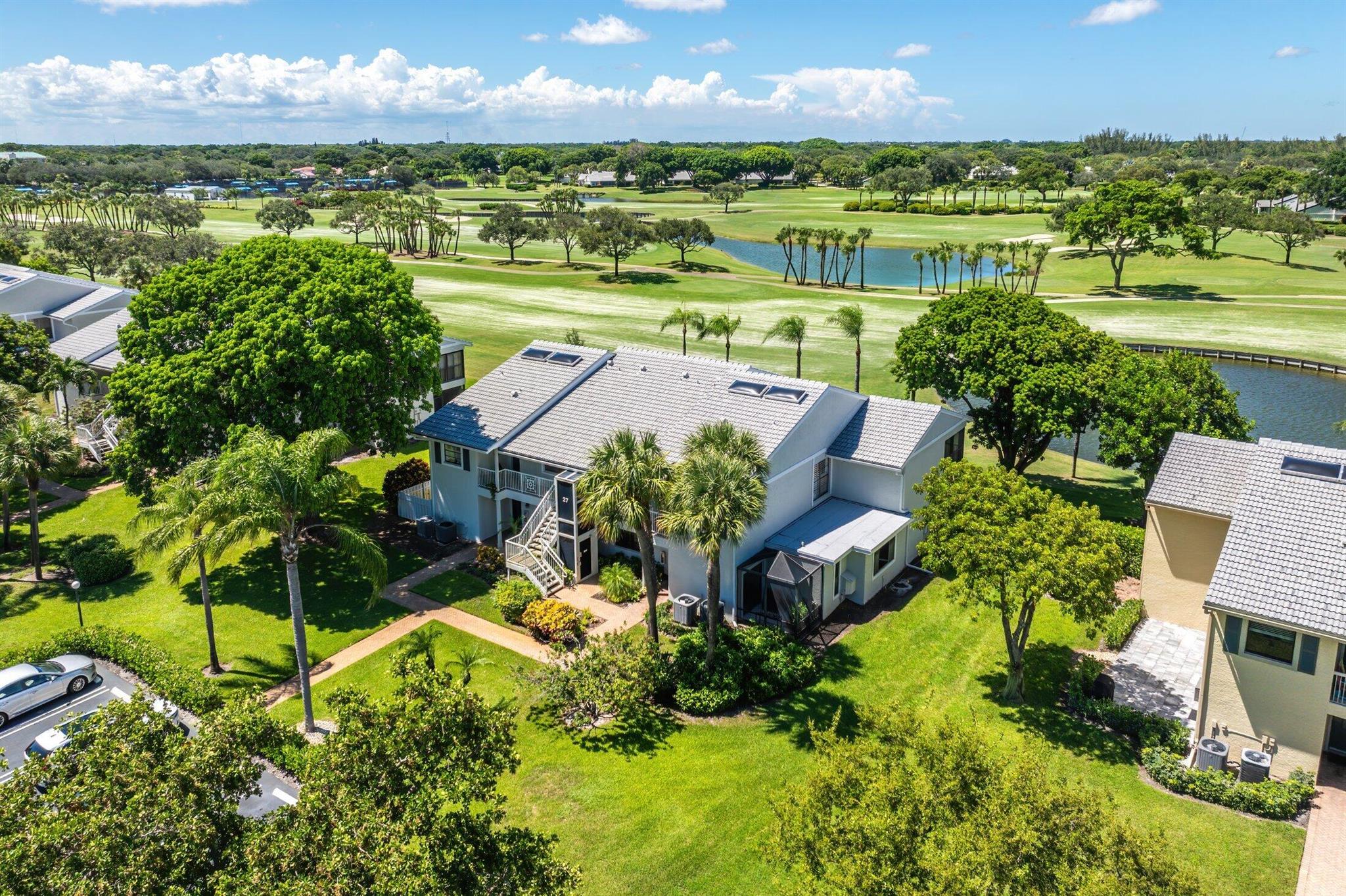 This spacious, sun-filled 2nd-floor condo showcases breathtaking lake and golf course views. Dramatic cathedral ceilings and skylights enhance the space with light and grandeur. Featuring 2 bedrooms, 2 baths, plus a den/convertible 3rd bedroom, an updated kitchen with wood cabinets, granite counters & SS appliances, a primary en-suite with spa tub, plus recessed lighting and plantation shutters throughout. Sweeping vistas can be enjoyed from nearly every room, with the screened-in lanai offering the perfect spot to savor al fresco meals against a backdrop of the glistening lake and lush fairways. Experience idyllic living at Hunters Run Country Club, a premier community where vibrant amenities make everyday life feel like a vacation.