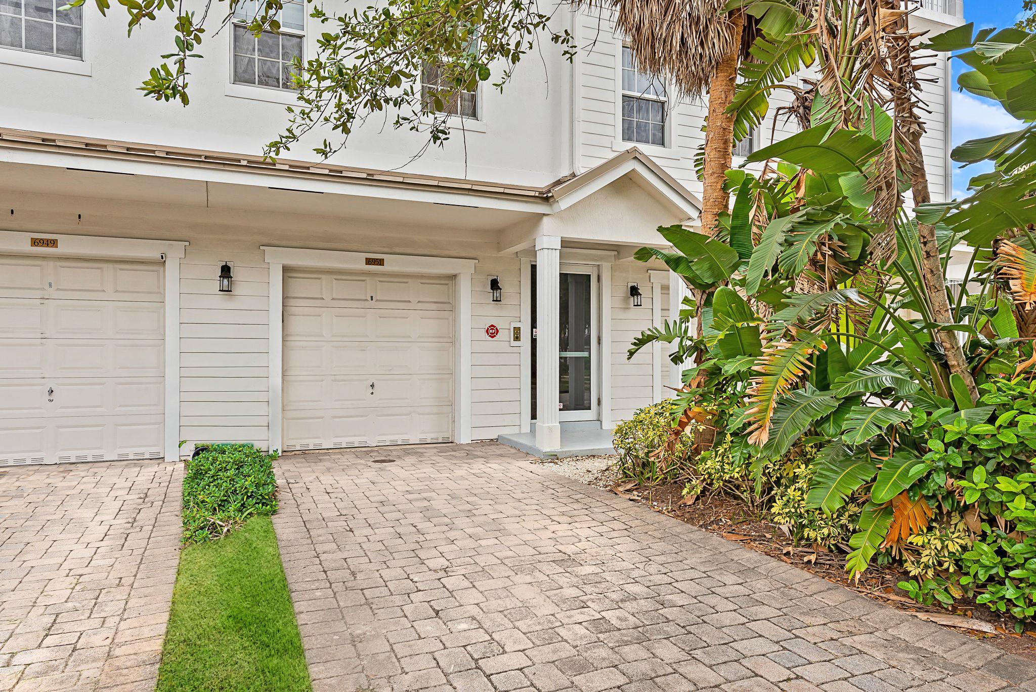 STUNNING south Florida townhouse located in the heart of Davie. Well-appointed, ultra-modern kitchen complete with quartz countertops, soft-close drawers, stainless appliances, and custom, luxury refrigerator. Open floor plan, light and bright with lovely view of this charming neighborhood. TWO large primary bedrooms upstairs with their own balconies AND updated bathrooms. Both bedrooms have walk-in closets with built-in cabinetry to maximize organization and storage. IMPACT WINDOWS, A/C 2022, roof covered by HOA. FULL SIZE laundry room, 1 car garage, plus ample parking in large driveway. WON’T LAST!