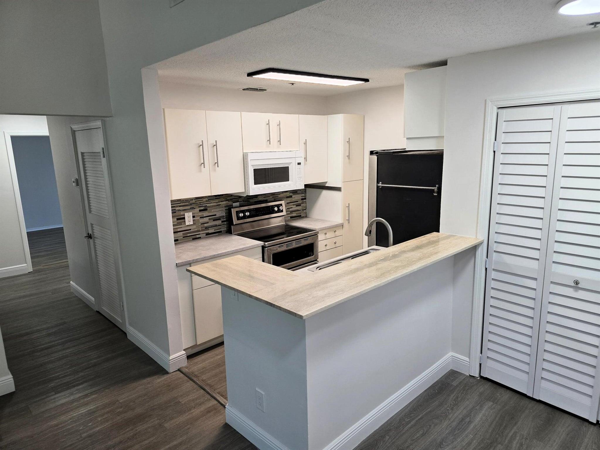 Brand New Hurricane-Impact Windows and Doors | Freshly Painted Interior Featuring New Custom Closets, Modern Door Levers, and a Keyless Electronic Front Door LockUpgraded Lighting Fixtures & Stylish Window Treatments ThroughoutIdeally Located Just Minutes from I-95 and Only Steps Away from the Newly Renovated Community Pool and ClubhouseGated Community in the Heart of Boynton Beach--Within Walking Distance to Renaissance Commons' Dining, Shopping, Bars, and Vibrant Nightlife