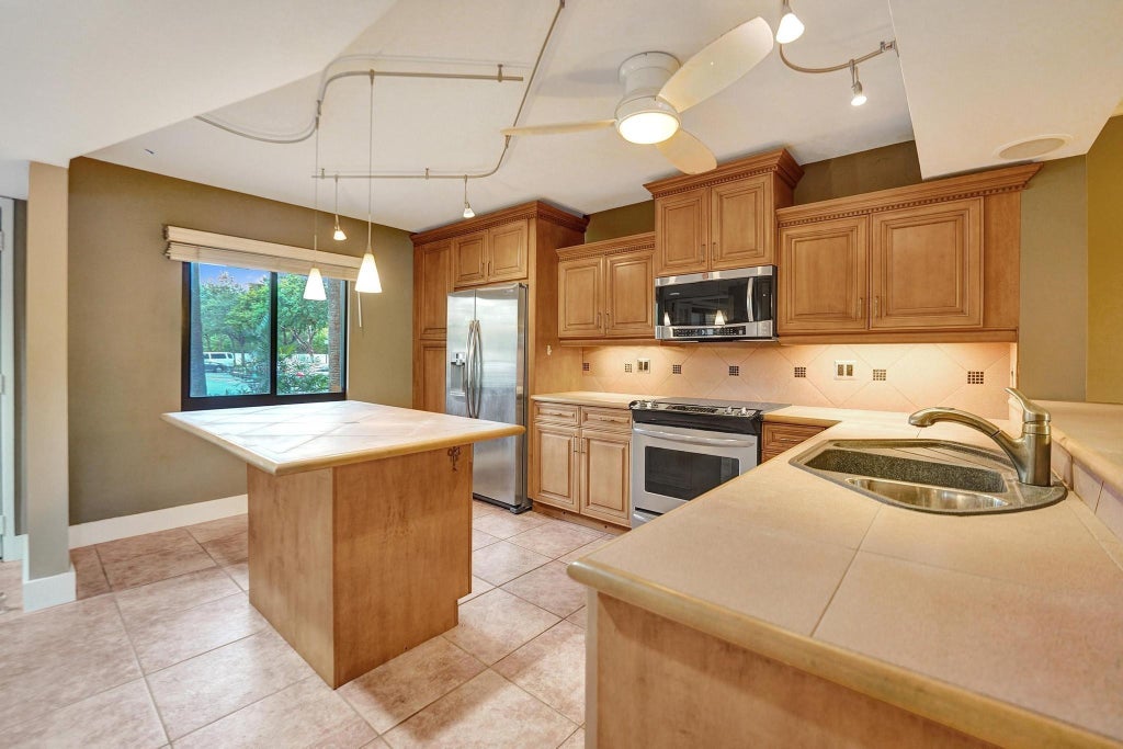 Photo of 2200 S Cypress Bend Drive #102, Pompano Beach, FL 33069 (MLS # F10474307)