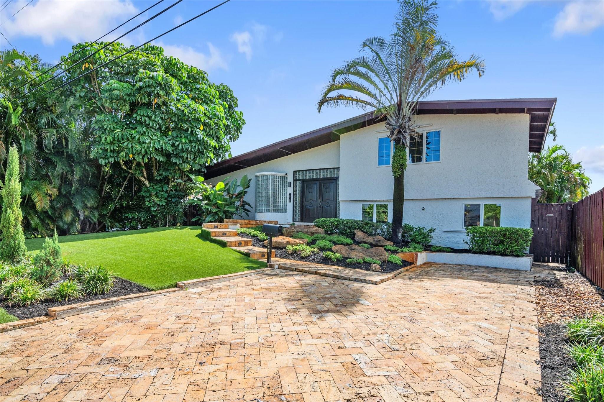 Boater’s Dream Rental! Spacious tri-level waterfront pool home with no fixed bridges and direct ocean access. Private dock accommodates up to a 55' boat. Enjoy tropical outdoor living with a resort-style pool, expansive patio, and lush landscaping. Home features 4 bedrooms and 4 full baths, including two primary suites and updated bathrooms. Interior offers high ceilings, marble and wood flooring, and a well-designed split layout for privacy. Classic charm inside with plenty of room to relax or entertain. Ideal for boaters or anyone seeking the ultimate South Florida lifestyle. Great location, next to I-95, I-595, 441 and airport!