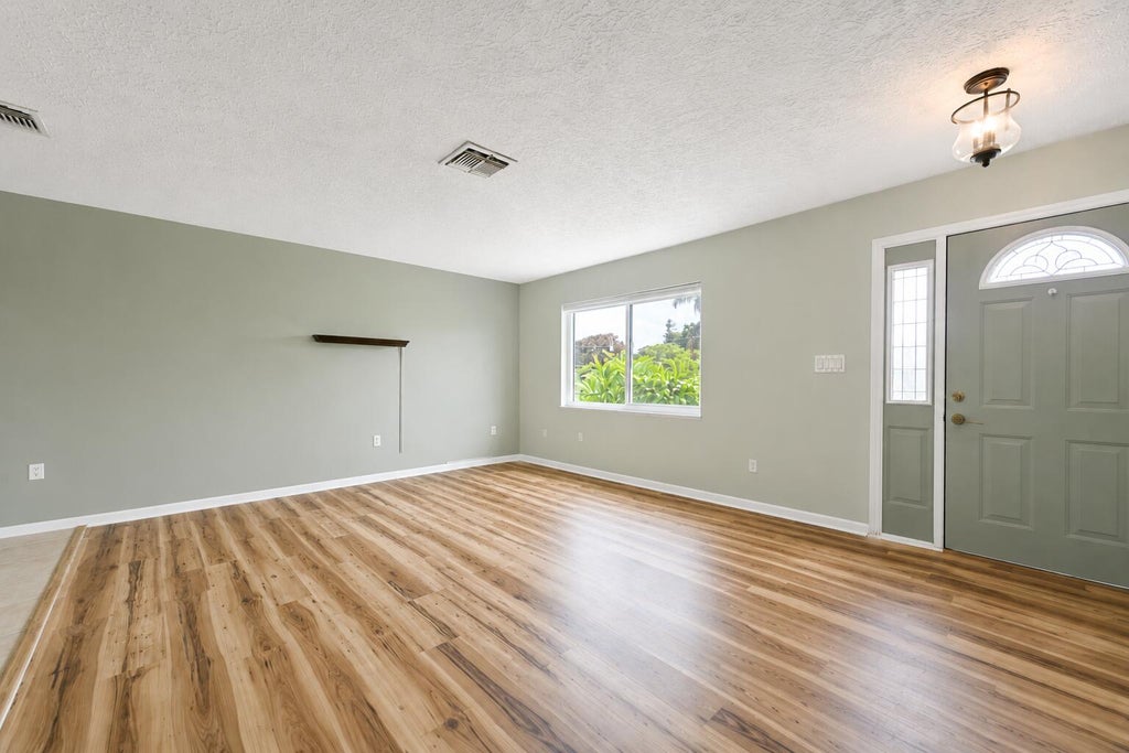 Photo of 2485 SE SIDONIA Street, Port Saint Lucie, FL 34952 (MLS # B26062233)