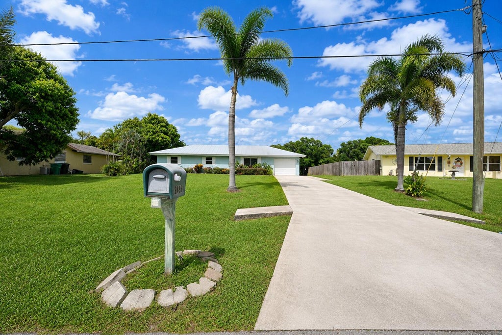 Photo of 2485 SE SIDONIA Street, Port Saint Lucie, FL 34952 (MLS # B26062233)