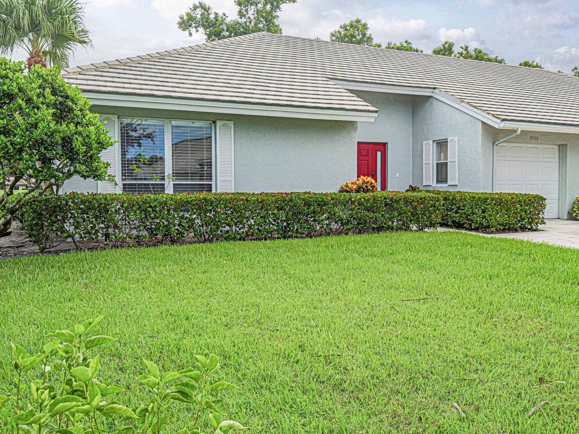 BRING ALL OFFERS!   3-bedroom, 2-bathroom end-unit villa featuring 1,605 SF, cathedral vaulted ceilings, and serene golf course views in sought-after Martin Downs Country Club. This home boasts a spacious living room with screened patio, abundant closet space, and natural light throughout.1 car garage, and 4-car driveway. HOA fees include high-speed cable with two boxes, pest control, roof maintenance, and exterior upkeep--buyers only need affordable  condo insurance! Community amenities include Martin Downs Golf Club, private Banyan Creek Golf Club with memberships available.  Optional Village Club membership offers pools, tennis, basketball, fitness trails Close to Turnpike and I 95. Top rated schools and restaurants and shopping.  3 year home warranty included