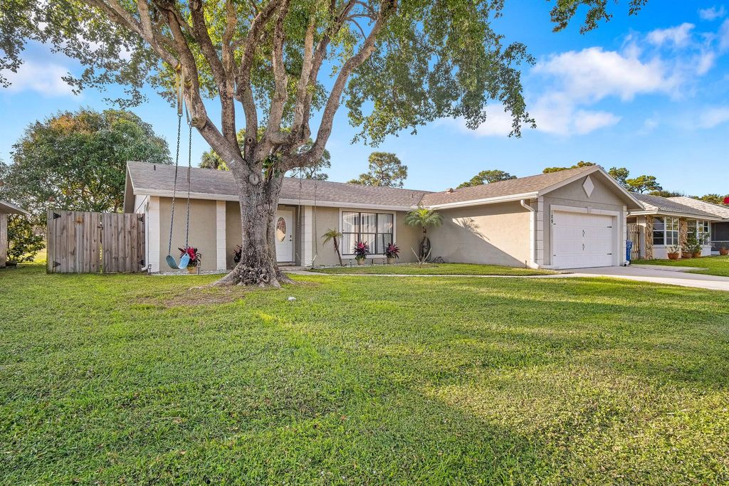 Photo of 109 Timber Run W, Riviera Beach, FL 33407 (MLS # R11050852)