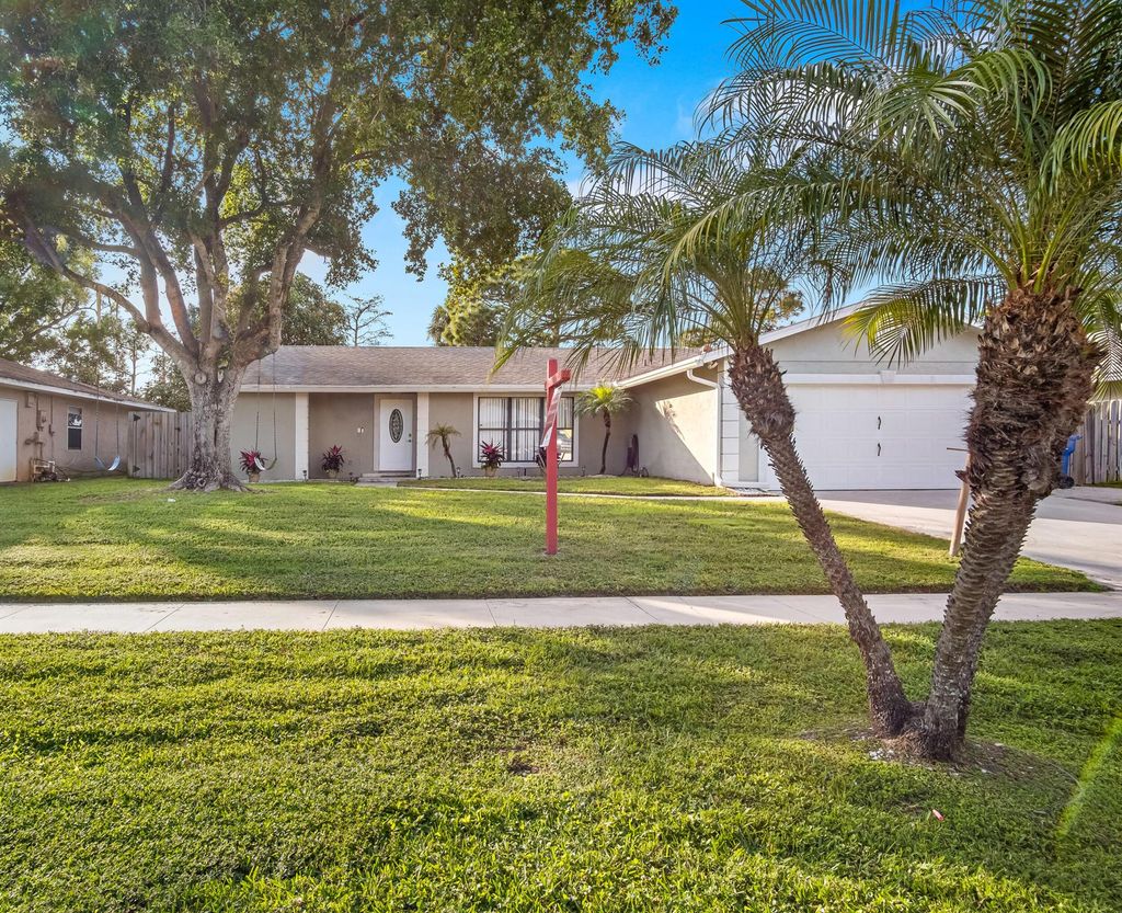 Photo of 109 Timber Run W, Riviera Beach, FL 33407 (MLS # R11050852)