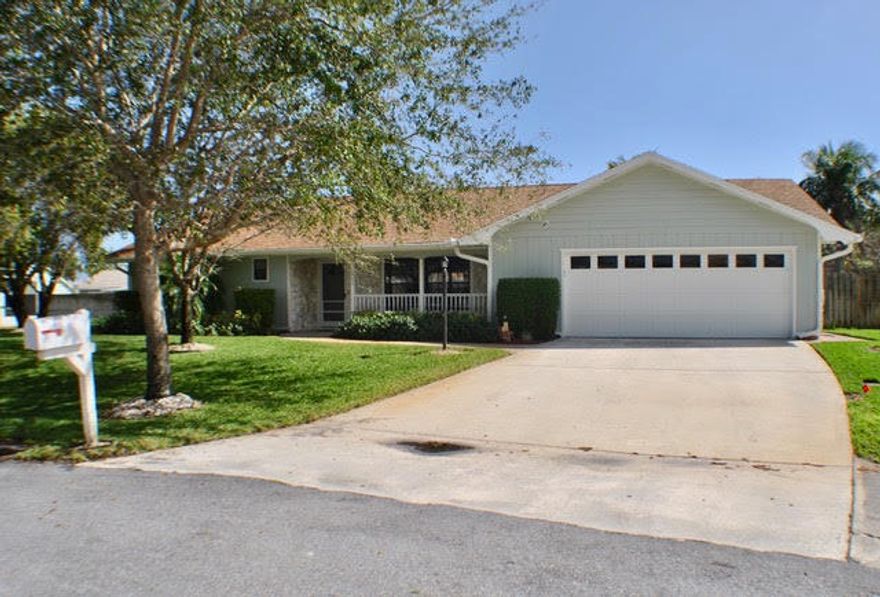 BEAUTIFUL, meticulously maintained home located on a quiet CUL DE SAC in JENSEN PARK ESTATES! Welcome home to this spacious 3 bedroom,2.5 bathroom home with an over-sized 2 car garage. This home has it all! Custom granite kitchen with 42''upper cabinets that are self closing, tumbled marble back splash, Stainless Steel appliance package, custom pantry area, travertine floors and a pass through window to your huge 26x12 screened patio. Main living area boasts Laminate wood floors, crown molding and recessed lighting.Guest bedrooms have laminate wood flooring and crown molding. Master bedroom has carpet and crown molding.All bathrooms have been updated with new granite and tile. All closets are a custom California Style closet. Definitely a gem in beautiful Jensen Beach! Must see Home!