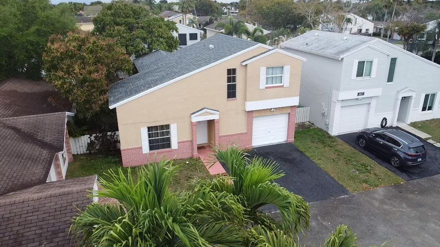 Beautifully maintained upgraded home in a desirable, well-established community. Features a rare additional bedroom conversion, making it one of the only functional 4-bedroom style homes in the neighborhood. Recent updates include a 2023 roof, 2021 water heater, bathroom improvements, repaired upstairs walls, refreshed cabinetry, and granite countertops. Ideally located about 15 minutes from Fort Lauderdale-Hollywood International Airport, 15-20 minutes to Port Everglades, and approximately 20 minutes to Fort Lauderdale and area beaches. Close to well-known schools including Western High School and Indian Ridge Middle School. The property also offers mature producing mango trees, including Eastern and Julian varieties, plus a low HOA of approximately $151.