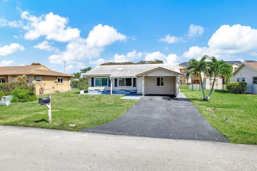 Beautiful single-family home facing a serene canal, offering both charm and functionality. Features include wood-look tile flooring throughout, impact windows and doors for added security and energy efficiency, and a smart sprinkler system that draws water directly from the canal—helping reduce your water bill.