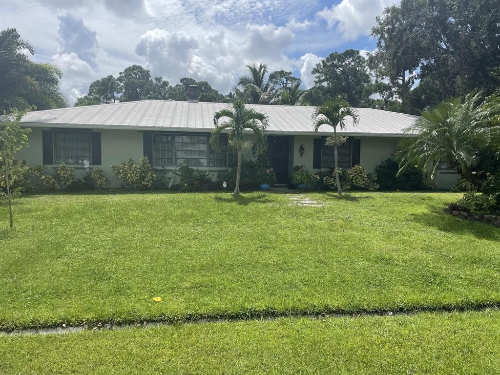 Photo of 3202 SW Nutley Street, Port Saint Lucie, FL 34953 (MLS # R10746925)