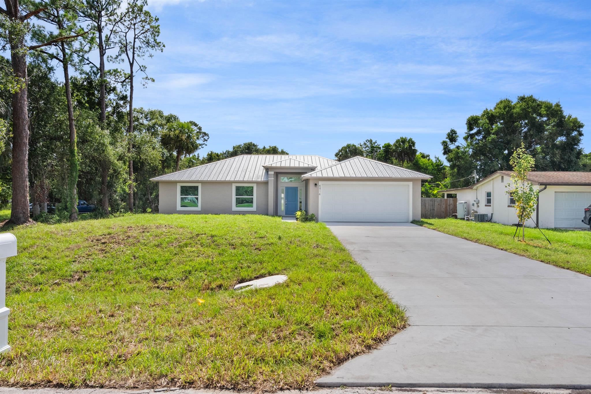 !!NEW CONSTRUCTION HOME!! Come see this beautiful 4 Bedroom, 2 Bath 2 Car garage With a split plan for privacy The 4th Bedroom could also be an office/den. All on an oversized 1/4 acre lot. With Block Construction, Metal Roof, Impact Glass, Stuccoed Soffits for you to feel safe in your new Florida Home with a back patio 10x14. Oh Yea did I mention it's waterfront on Lake Philipp with picnic tables and Library within walking distance. The shopping is within a mile and close to 95 and the Beaches. And now for the inside Porcelain Carrara Marble look tile throughout , Kitchen area, and Tiled Bathrooms. Quartz countertops. And Custom all wood Modern Designed Cabinets with slow close draws and slow close 42'' uppers So definitley put this one on the list and you will not be dissapointe