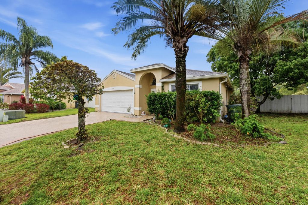 Photo of 1724 Sawgrass Circle, Greenacres, FL 33413 (MLS # B26018432)