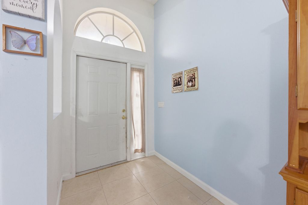 Photo of 1724 Sawgrass Circle, Greenacres, FL 33413 (MLS # B26018432)