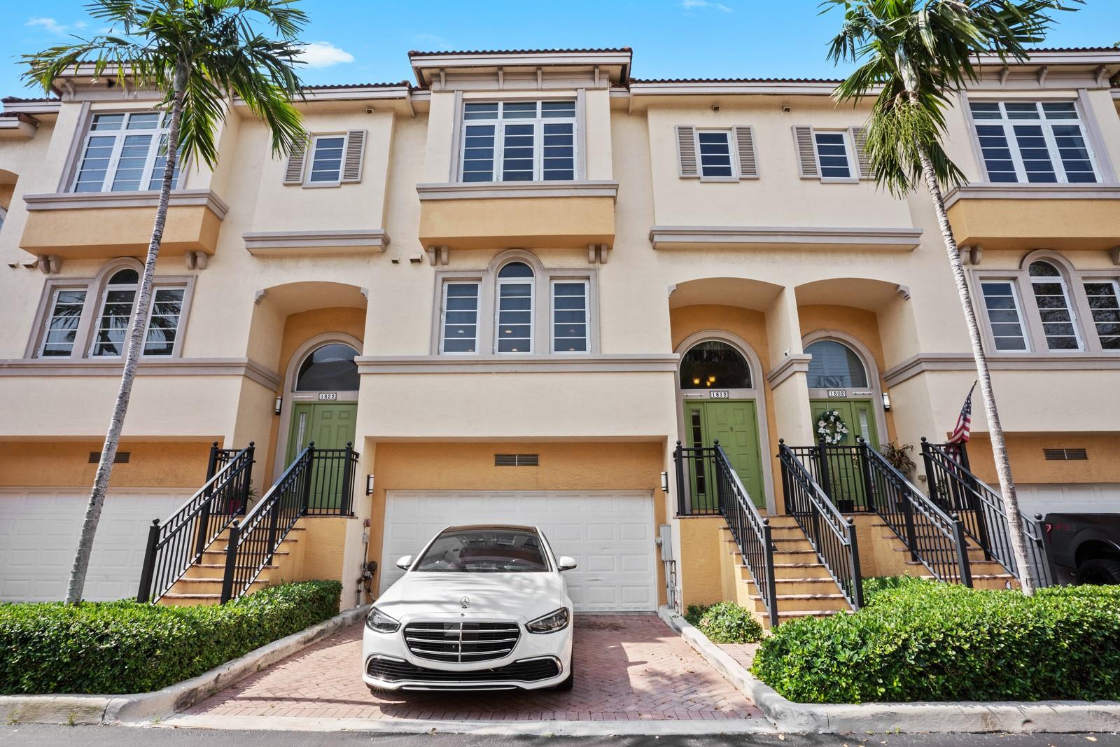 LARGE STYLISH CORNER UNIT 3 BED, 3.5 BATHS, 2 CAR GARAGE, 2,306 SQ FT WITH ONE OF THE LARGEST BACKYARDS IN COMPLEX . BRAND NEW FLAT TILE ROOF AND EXTERIOR PAINT 2024. ASSESSMENTS PAID IN FULL. UNIT LOCATED IN QUIET BACK CORNER OF COMPLEX, CLOSE TO POOL, CLUBHOUSE/KITCHEN AND GUEST PARKING. OPEN FLOOR PLAN HAS HIGH CEILINGS WITH HALF BATH ON MAIN LEVEL FOR GUESTS. EACH BEDROOM HAS ITS OWN FULL BATH. HURRICANE IMPACT DOORS/WINDOWS. IT HAS TILE FLOORS/STAIRS THOUGHOUT. CENTRAL VAC. LOTS OF KITCHEN CABINETS & STORAGE. LOW $600 MONTHLY HOA FEES. PET FRIENDLY COMMUNITY. CLOSE TO BEACH, RESTAURANTS, STORES, HOLY CROSS HOSPITAL, EXCELLENT SCHOOLS AND A SHORT WALK TO LA FITNESS. TOWNHOUSE AND COMMUNITY WELL MAINTAINED.