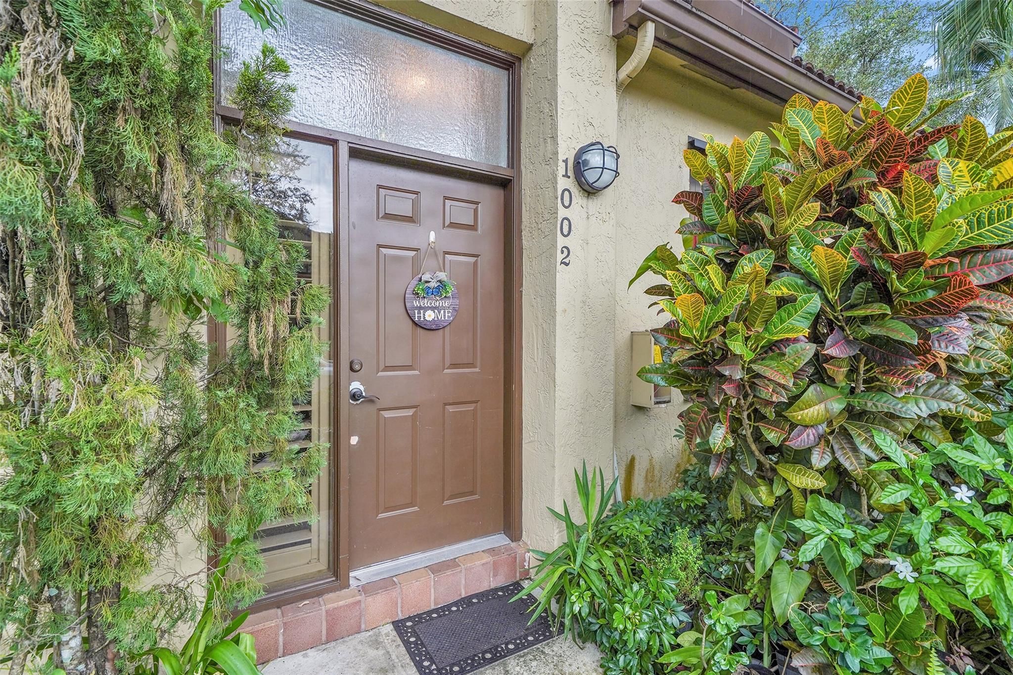 Spacious 3-bedroom, 2-bath coach home with a one-car garage located in the heart of Plantation. The entrance is on the first floor, with stairs leading up to the main living area. This home features impact windows, Plantation shutters, a large dining and living room, and an eat-in kitchen. The primary suite includes two walk-in closets with custom built-ins. Enjoy the convenience of an in-unit washer and dryer and relax on the second floor screened balcony. The Bridgewater Community has pool, park, basketball courts, tennis courts and a walking trail. Close to public and private schools, walking distance to religious institutions, near Publix, Winn-Dixie, 595, Sawgrass Expressway and I-75. Available in October.