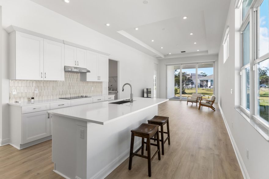 MOVE IN READY NEW CONSTRUCTION, NO NEED TO WAIT! Built in 2023, meticulously cared for ''Caroline'' model in Rivelle's gated community, offers a one story bright and airy open concept, 3 bedrooms plus office/den, 2 baths, and a 2-car garage. Soaring 11'4'' ceilings and impact windows with CUSTOM/UPGRADED motorized shades!! Gourmet kitchen with 42'' cabinets and all stainless appliances included. UPGRADED epoxy garage floors and elegant tray ceilings. Lovely NEW wood plank flooring as well. Rivella is a boutique community of approximately 317 homes. Enjoy top-notch amenities including tennis courts, a fitness center, and a swimming pool. Pickleball courts on the horizon too! Just 15-18 minutes to Downtown Stuart and Jensen Beach. Only 20-25 minutes to beautiful Treasure Coast beaches!