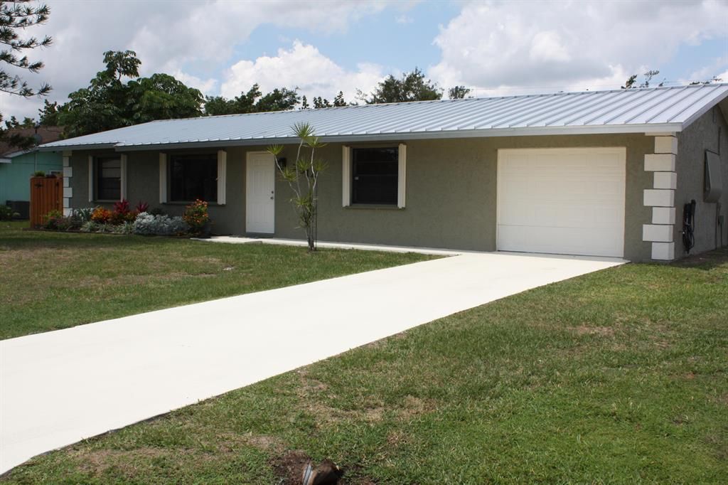 Photo of 2314 SE Patio Circle, Port Saint Lucie, FL 34952 (MLS # R10805035)