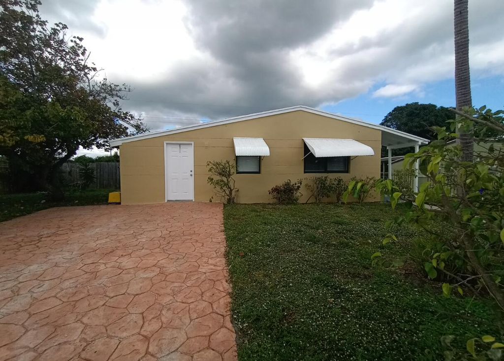 Photo of 1080 W 27th Street, Riviera Beach, FL 33404 (MLS # R11159295)