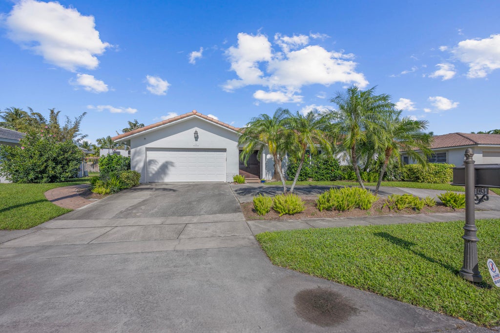 Photo of 1051 NW 9th Street, Boca Raton, FL 33486 (MLS # B26028105)