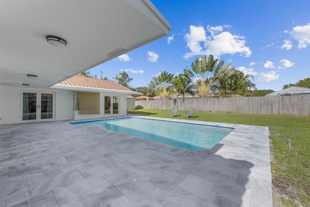 Photo of 1051 NW 9th Street, Boca Raton, FL 33486 (MLS # B26028105)