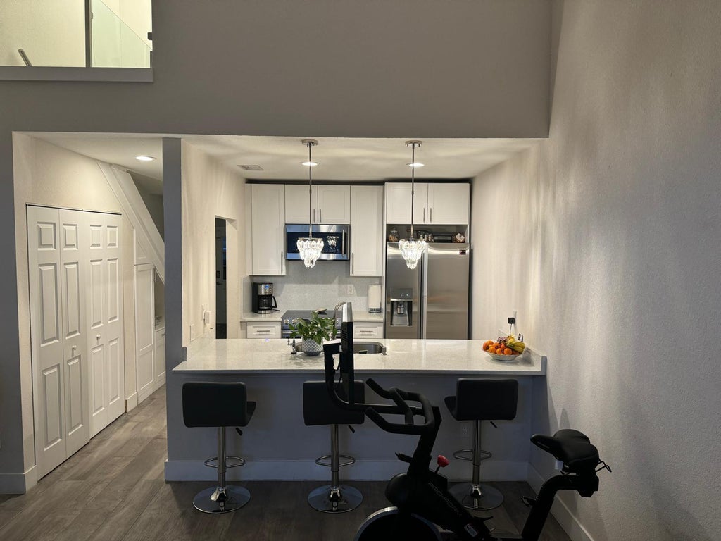Photo of 1240 PARKSIDE GREEN Drive #C, Greenacres, FL 33415 (MLS # B26085168)