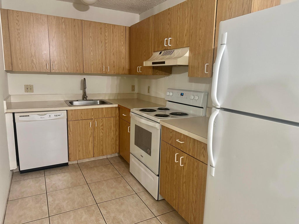 Photo of 5050 SANCTUARY Way #G, West Palm Beach, FL 33417 (MLS # B26078952)