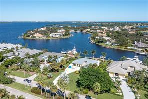 This Moorings waterfront home features wide views of canal and Intracoastal waterway;. Over 117' of waterfrontage! Gracious lot size of .51 AC (199.48 deep). The 2018 seawall, dock and lift with great water depth and easy access to the Intracoastal make this a good choice for boaters. Home is 3 bedrooms, 2 1/2 baths with 2,577 SF of living space. New metal roof in 2016. Belonging to Moorings Property Owner's Assoc. provides private beach access and security patrol: $468 annually. Sold As-Is, inspections welcomed. Golf Club membership potential, ask for details! Sizes approx. Buyer to verify.